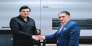 Gulf Craft and Giffin Graphics celebrate the successful installation of the first DURST RHOTEX 325 in Qatar